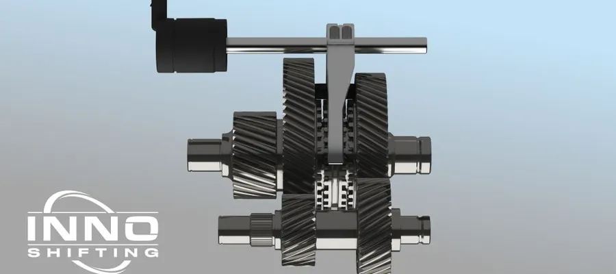 Zahnräder und Wellen eines mechanischen Getriebes mit dem Schriftzug 'INNO SHIFTING'