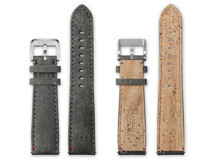 Zwei graue Uhrenarmbänder aus Leder mit silbernen Dornschließen, Rückseiten zeigen pflanzenbasierte Lederstruktur.