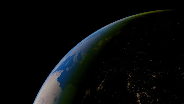 Teilansicht der Erde aus dem Weltraum mit sichtbaren Landmassen und beleuchteten Städten in der Nacht